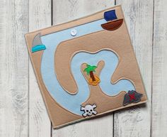 this is an image of a handmade felt board with a beach scene on it