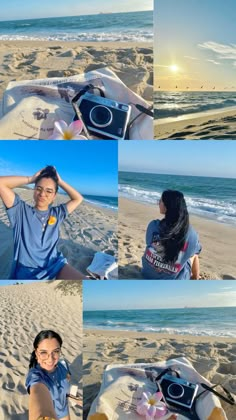 a woman sitting on top of a sandy beach next to the ocean holding a camera