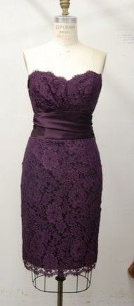 a mannequin wearing a purple lace dress