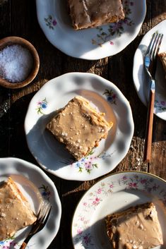 there are four plates with desserts on them, one has frosting and the other has sugar