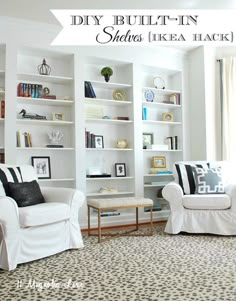 a living room filled with white furniture and bookshelves