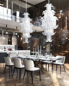 an elegant dining room with chandelier and table in the center, surrounded by glass stairs