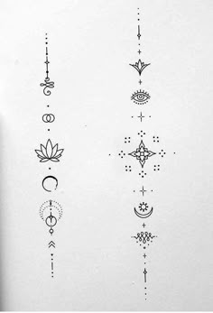 some tattoos on the side of a white sheet with stars and crescents in them