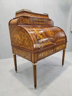 an old wooden desk with intricate designs on it