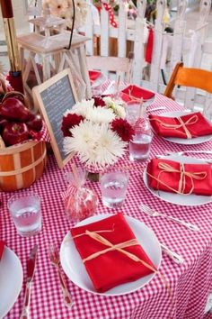 the table is set with red and white napkins