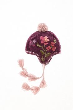 Inspired by vintage textiles, the Ruthie Earflap combines cross stitch and stab stitches to create an artistic floral motif. Every stitch tells a story of skill, passion, and enduring beauty. Pair with our Ruthie Handwarmers for a coordinating look! 100% wool. Fleece Lined. Handmade in Nepal. Hand Accessories, French Knots, Knit Hats, French Knot, Seasonal Gifts, Vintage Textiles, Winter Style, Hand Warmers, Floral Motif