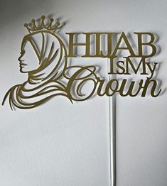 a cake topper with the words hiab is my crown on it and a woman's head