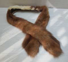 From a local estate, this original Brown Fox Tails fur wrap or scarf is in great condition. No flaws that I can see. It will be great for any collection or outfit. PLEASE NOTE THAT THE FOX IS VINTAGE MADE AROUND 1970's. ALL IS OLD STOCK. It is great for Viking, Celtic or Warrior outfits. Size: You can see the measurements in the photos. If you require any more information or pictures please contact me. Warrior Outfits, Fox Tails, Fox Fur Scarf, Warrior Outfit, Vintage Fox, Fur Wrap, Fur Scarf, Cardiff, Taxidermy