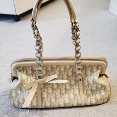 100% Authentic Vintage Christian Dior Diorissimo Trotter Romantique Shoulder Bag Beige And White With Silver Chain Handle 14" X 7.5" X 5" Preowned Condition With Flaws Interior Fabric Is Mostly Clean But Leather Has Minor Marks Exterior Has Chipping Of Majority Of Leather Piping (See Photos) And Some Stains/Marks Handles In Good Condition Vintage Dior Bag Outfit, Beige Designer Bag, White Monogram Canvas Bag For Formal Occasions, Dior Romantique Bag, Elegant Monogram Canvas Bags For Formal Occasions, Vintage Dior Aesthetic, Dior Bag Aesthetic, Jocelyn Core, Dior Trotter Bag