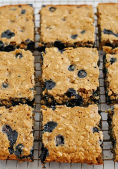 blueberry oatmeal bars are cooling on a wire rack, ready to be eaten