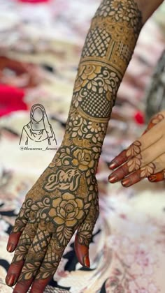 two hands with henna tattoos on them