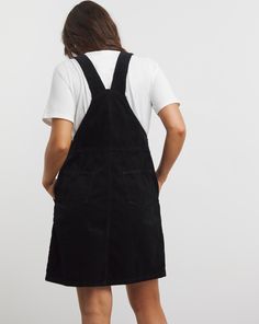 Our stunning black cord denim dungaree dress is perfect for the season. It features seam detailing, a mini lenth, front and back pockets, and adjustable shoulder straps - all in a gorgeous black cord. Pair with a bodysuit, tights and boots for the perfect day-to-night look. Denim Dungaree Dress, Denim Dungaree, Dungaree Dress, Tights And Boots, Fall Coat, Simply Be, Boots Fall, Night Looks, Skirted Swimwear