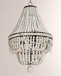 a white chandelier hanging from a ceiling