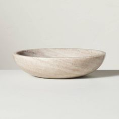 a white bowl sitting on top of a table