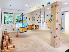 a child's playroom with toys and climbing equipment in the room, including a toy sailboat