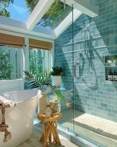 a bath room with a stand up shower and a tub