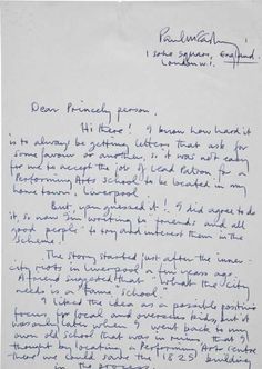 a handwritten letter written in blue ink on white paper with writing underneath the letters