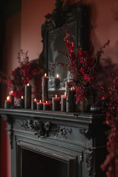 a mantel with candles and flowers on it