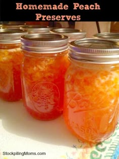 four mason jars filled with homemade peach preserves