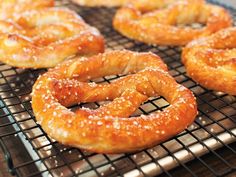 several pretzels are cooling on a rack in the oven and sprinkled with sugar