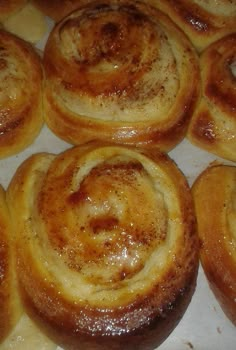 several cinnamon rolls sitting on top of a pan