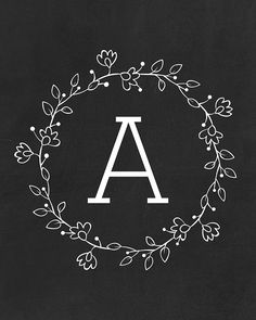 a monogrammed wreath with the letter a in it's center on a black background