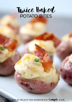 bacon and cheese stuffed potato bites on a white plate