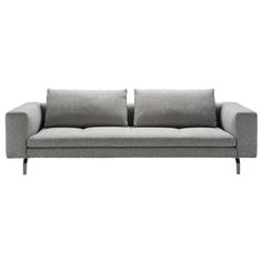 a gray couch with two pillows on it's back and one arm facing the camera