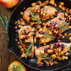 chicken with apples and cranberries in a skillet