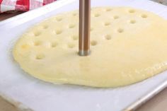 a pizza dough being made on a pan