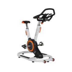 an exercise bike is shown with the seat on it's back and wheels down