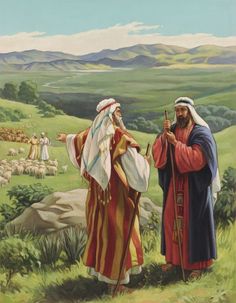 an image of two men standing in the grass talking to each other with mountains in the background