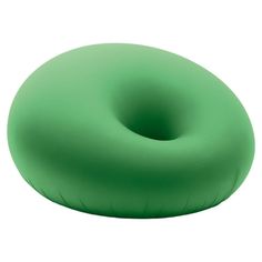 an inflatable donut pillow is shown on a white background, with the green color