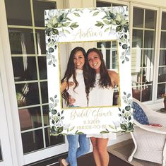 two beautiful women standing next to each other in front of a door with an ornate frame