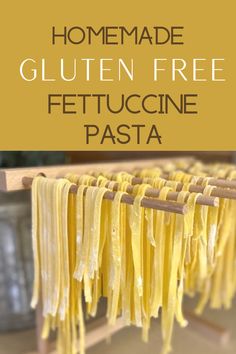 homemade gluten free fettuccine pasta on a wooden rack with text overlay