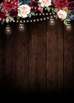 flowers and mason jars are hanging on a wooden wall with string lights in the middle