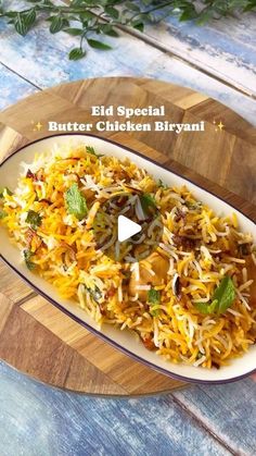 an image of a plate of food on a cutting board with the words eid special butter chicken biriyani