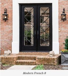 the front door to a brick house with glass panels and stone steps leading up to it