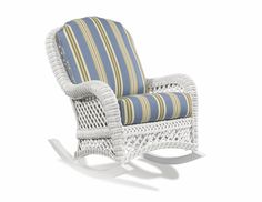 a white rocking chair with blue and yellow striped cushions