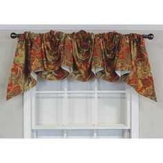 a window with a red and gold curtain valance hanging from it's side