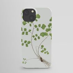 an iphone case with green leaves and roots on it, showing the back side of the phone