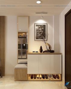 a modern kitchen with white cabinets and wood accents is shown in this image, there are shoes lined up on the counter