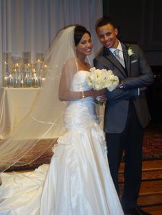 a bride and groom pose for a photo in front of the alter at their wedding