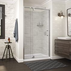 a bathroom with a sink, mirror and shower stall in the middle of the room