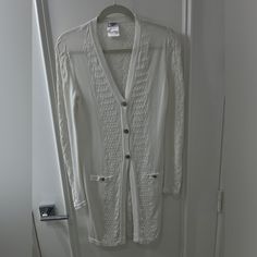 This Beautiful Classic Knit White Long Sleeve Chanel Cardigan Is In Near Perfect Condition As Pictured Luxury White Chunky Knit Cardigan, Luxury White Cozy Cardigan, Luxury White Mohair Cardigan, Luxury White Soft Knit Cardigan, Chanel Cardigan, Vintage White Cardigan With Button Closure, Chanel Sweater, White Knit Cardigan, White Long Sleeve