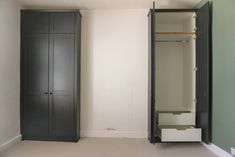 an empty room with two closets in it