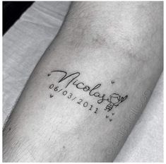 a person with a tattoo on their arm that says, nobody is 2013 - 2012