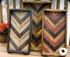 three wooden boxes sitting on top of a table