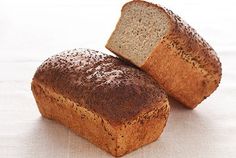 two loaves of bread sitting on top of a table