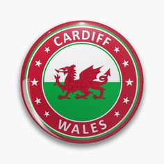 a red and green circular badge with the words gymru wales written on it